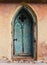 Old wooden ornate arched door