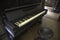 Old wooden piano in abandoned dark room