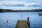 Old wooden pier or jetty for yachts and boats. Spring landscape of the coast of Sweden.