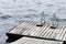 Old wooden pier with metal rails for swimming