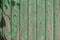 Old wooden plank background. Peeling, faded sea-green paint on the old boards. Copying space