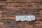 Old wooden plank wall with broken paint and mailboxes. Close-up photo