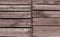 Old wooden planks in faded brown paint