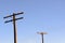 Old wooden power poles with glass insulators