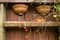 Old wooden rack with hanging teracotta flower pots