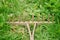 Old wooden rake on grass