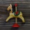 Old wooden red and green rocking horse for christmas decorations