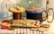 OLD WOODEN REELS WITH COTTON AND GLASS HEAD PINS WITH OTHER NEEDLEWORK ITEMS