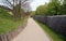 Old wooden road and fence in the mediaeval traditional village at the Kyivan Rus museum