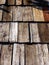 Old wooden roof tiles background. Wood background. Vintage. Wood roofing pattern detail. Old brown wooden shingle roof.View of