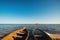 Old wooden rowing boats in sunny summer morning. Summer lake shore. Old fishing boats on the lake