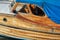 Old, wooden sailing boat cockpit or cabin closeup. The vessel windows are covered by cobwebs and the wooden finishing is worn