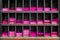 An old wooden shelves slots with magenta papers