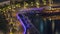 Old wooden ship near waterfront promenade aerial night timelapse.