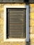 Old wooden slat shutter window