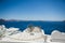 An old wooden spinning lathe above blue ocean in Santorini