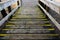 Old wooden stairway that go down. Going down stairs during outdoor walking.