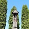 Old wooden statue in churchyard, Lithuania