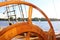 Old wooden steering wheel from the sailing ship