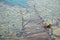 old wooden sunken pier on the shore of the red sea