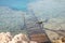 old wooden sunken pier on the shore of the red sea