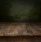 Old wooden table with dark background