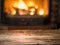 Old wooden table and fireplace with warm fire.