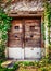 Old wooden textured door and weathered wall