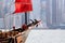 Old wooden tourist junk ferry boat in Victoria Harbor and famous Hong Kong island view with observation wheel