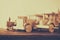 Old wooden transportation toys: train, car and track on wooden table. vintage filtered and toned