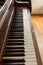 Old wooden upright piano keyboard