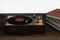 The old wooden vinyl record player on the table, 3d rendering