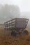 Old wooden wagon in fog
