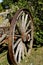 Old wooden wagon wheel as a backyard decoration