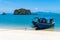 Old wooden walking boats that tied the rope on the shore on the tropical beach