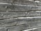 Old wooden wall of hewn natural logs