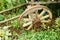 An old wooden wheel.Part of the cart. An ancient means of movement, with the help of horses.