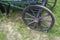 Old wooden wheel on a rural wagon, close - up