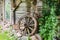 Old wooden wheel in village near old wooden house in Lithuania Europe