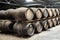 Old wooden whisky barrels in distillery warehouse