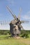 Old wooden windmill on the grassland