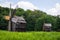 Old wooden windmills near a forest