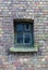 Old wooden window on the red brick wall texture background