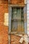 Old wooden windows ruined by time on facade of abandoned house in historic Diamantina, Minas Gerais