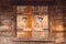 Old wooden windows of a wooden house with two cutouts of hearts