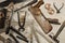 old woodworks tools: wooden planer, hammer, chisel in a carpentry workshop on wood background