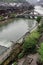 Old World charm along the promenade of Fenghuang Ancient City is highlighted by waterwheels and the towering Nanhua Bridge