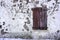 Old and worn closed wooden shutters