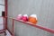 Old, worn, colorful and safety helmets of engineering construction workers with snow are on the hand railings of