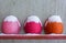 Old, worn, colorful and safety helmets of engineering construction workers with snow are on the hand railings of